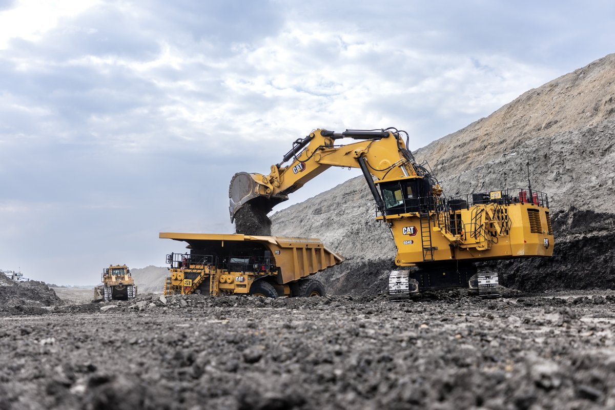 Caterpillar 6040 excavator loading a haul truck at a mine